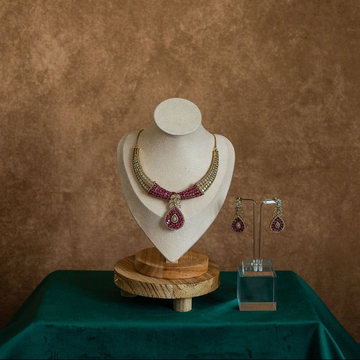 Jewelry set on a mannequin bust with a brown background